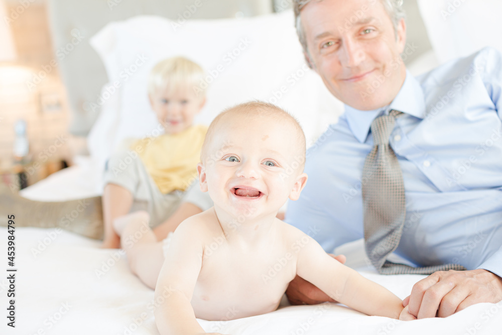 Father and children relaxing on bed Father and children relaxing on bed