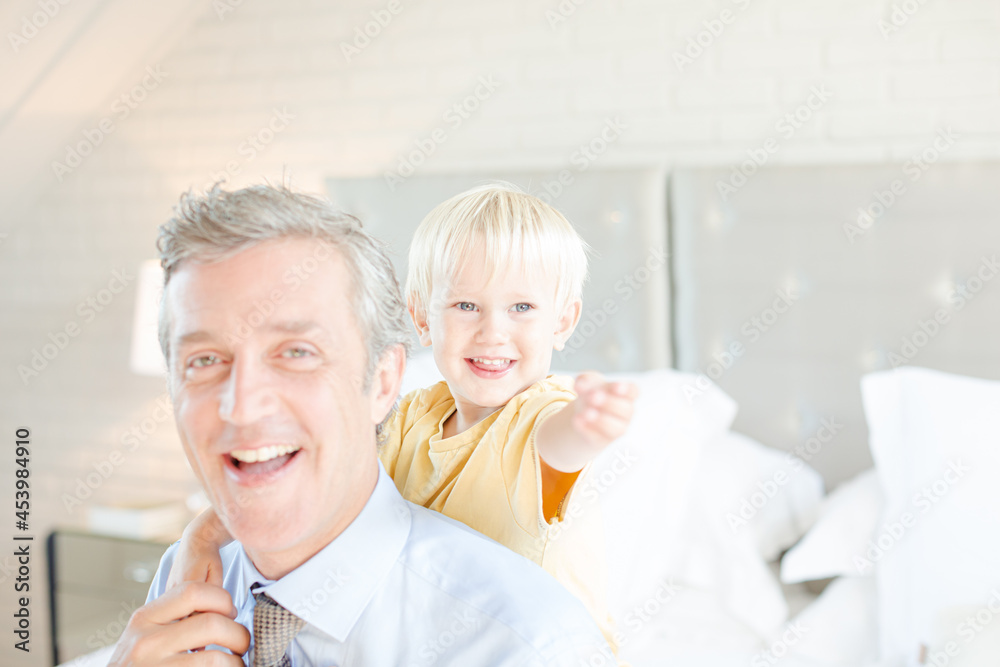 Father and son hugging on bed Father and son hugging on bed