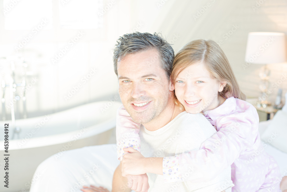 Father and daughter hugging on bed Father and daughter hugging on bed