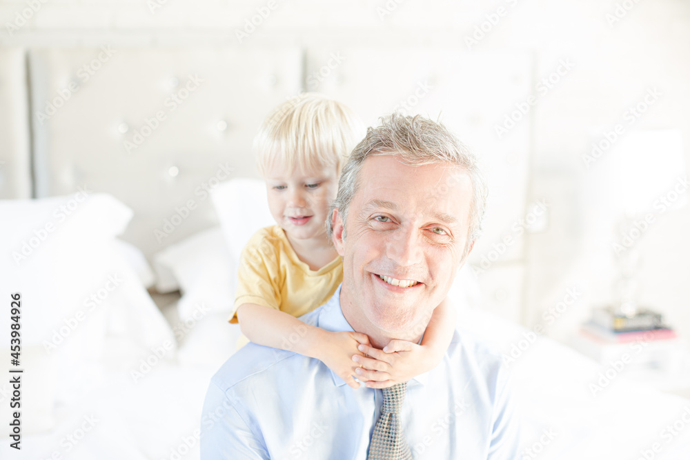 Father and son hugging on bed Father and son hugging on bed