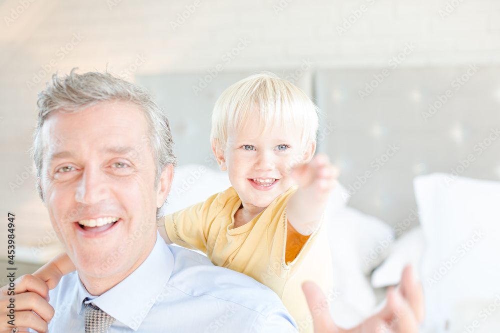 Father and son hugging on bed Father and son hugging on bed