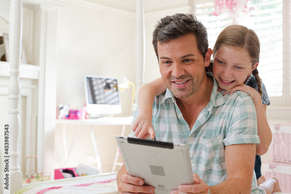 Father and daughter using digital tablet Father and daughter using digital tablet