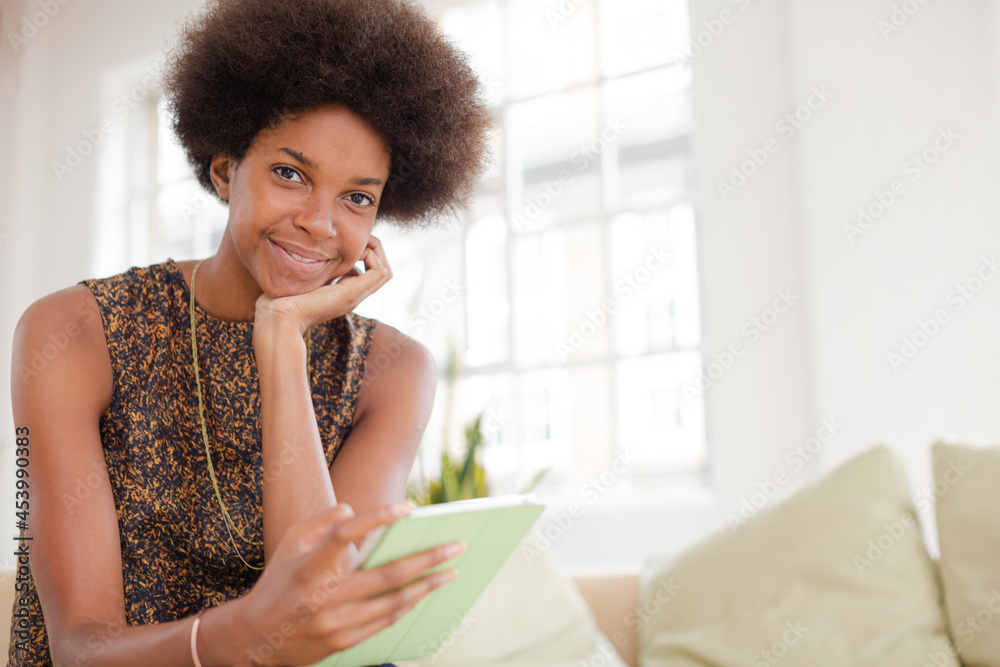 Woman using digital tablet on sofa Woman using digital tablet on sofa