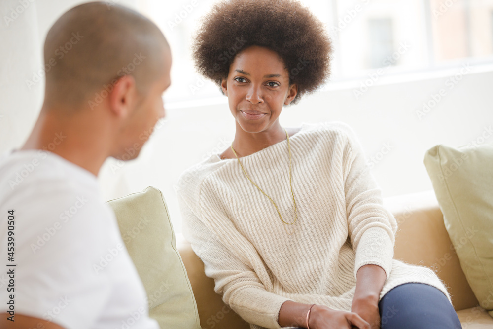 Couple talking indoors Couple talking indoors