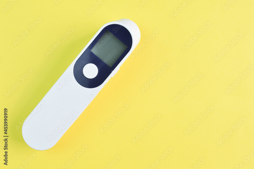 Digital thermometer isolated on a yellow background Digital thermometer isolated on a yellow background