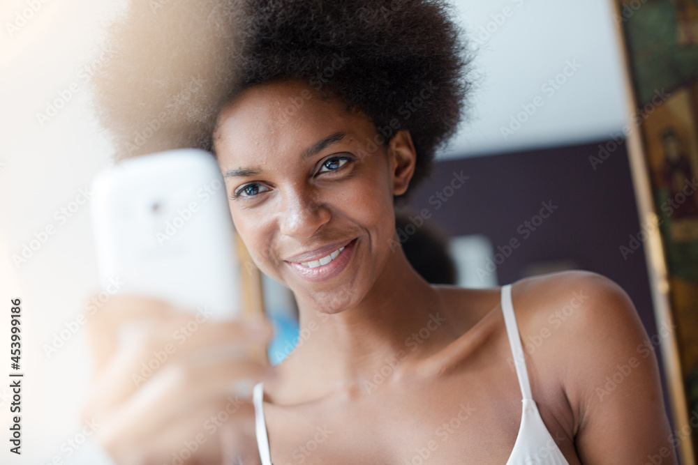 Smiling woman using cell phone Smiling woman using cell phone