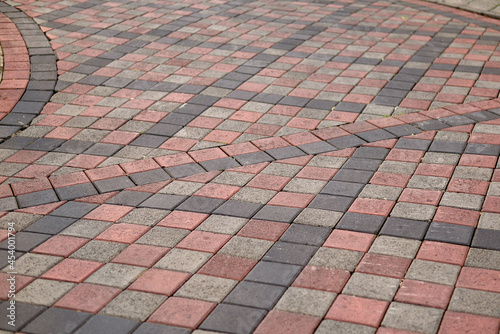 Paving stones. Concept of laying paving slabs and pavers. Paving stones. Concrete pavement blocks. can be used as background and wallpaper