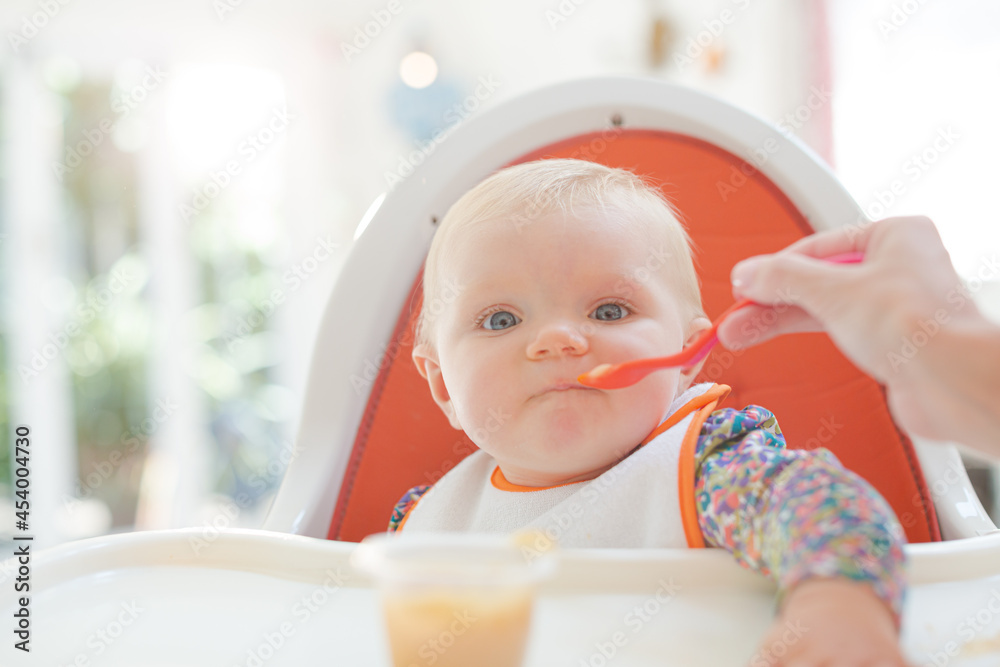 Mother playing with baby girl
