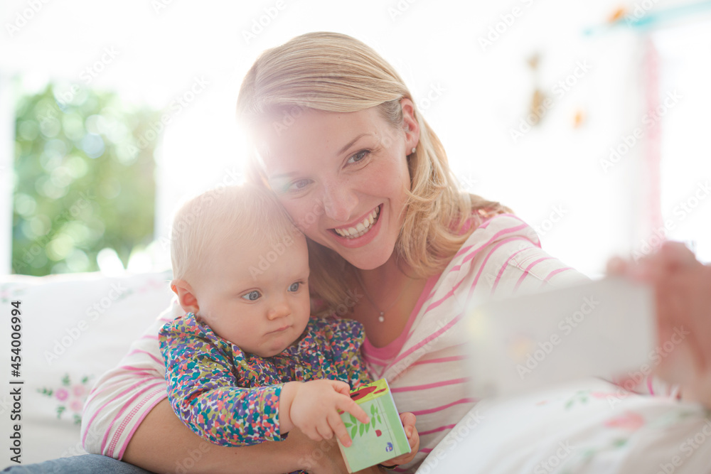 Mother taking self-portrait with baby girl Mother taking self-portrait with baby girl