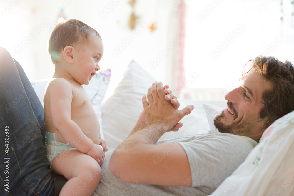 Father playing with baby boy Father playing with baby boy