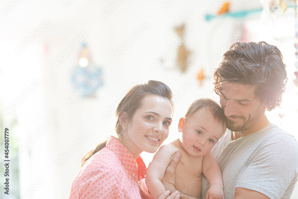 Parents smiling with baby boy