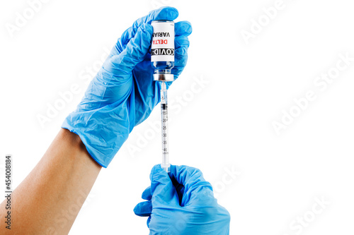 Vaccine bottles covid - 19 delta variant, vials medicine and syringe injection isolated on white. Coronavirus DELTA 2019-ncov. Vaccine bottles on the woman hand