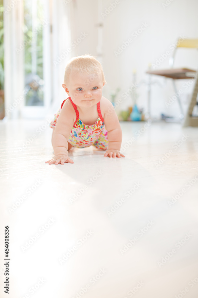 Baby girl crawling on floor Baby girl crawling on floor