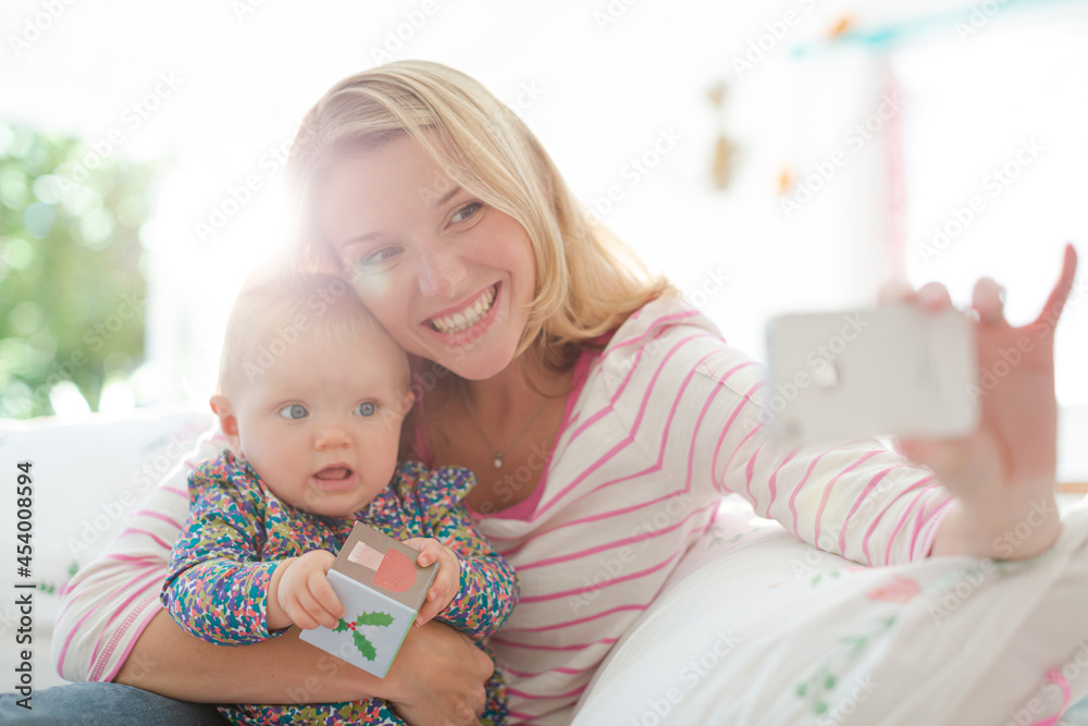 Mother taking self-portrait with baby girl Mother taking self-portrait with baby girl