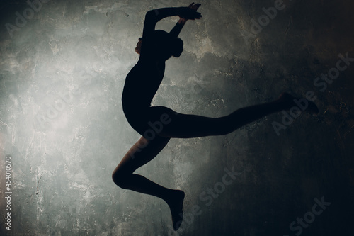 Young girl professional gymnast woman dance rhythmic gymnastics at studio.