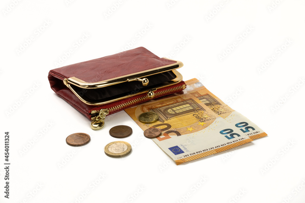 A red purse lying on fifty euro notes and coins, isolated A red purse lying on fifty euro notes and coins, isolated
