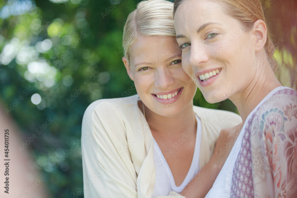 Fototapeta premium Women smiling together outdoors