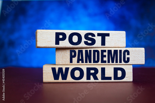 Wooden blocks with words Post-pandemic world. New normal social and business concept.