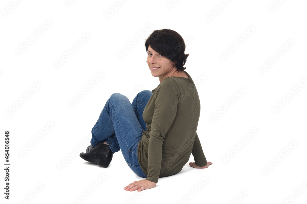 woman sitting on the floor looking at camera on white background woman sitting on the floor looking at camera on white background