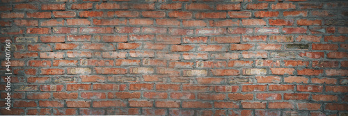 Red clay old brick wall background, weather staines old brick texture