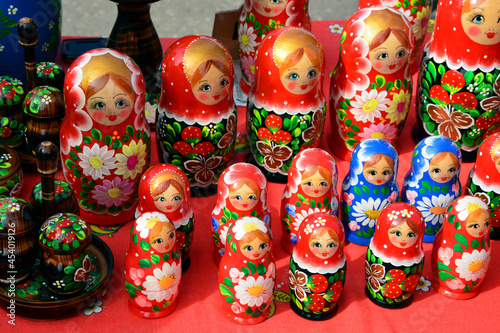 Matryoshka. Toys of the Slavic people, folk dolls matryoshka are sold in the market. © Lili-OK