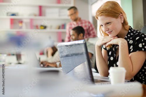 Woman working at laptop in office