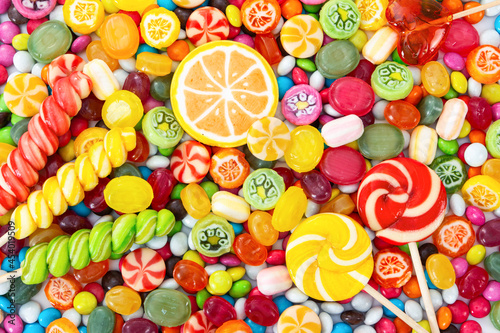 Colorful lollipops and different colored round candy. © Nataliia Pyzhova