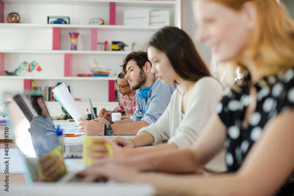 People working at conference table in office People working at conference table in office