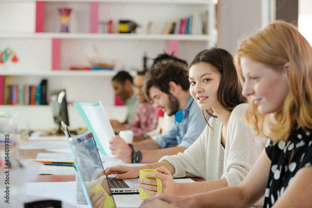 People working at conference table in office People working at conference table in office
