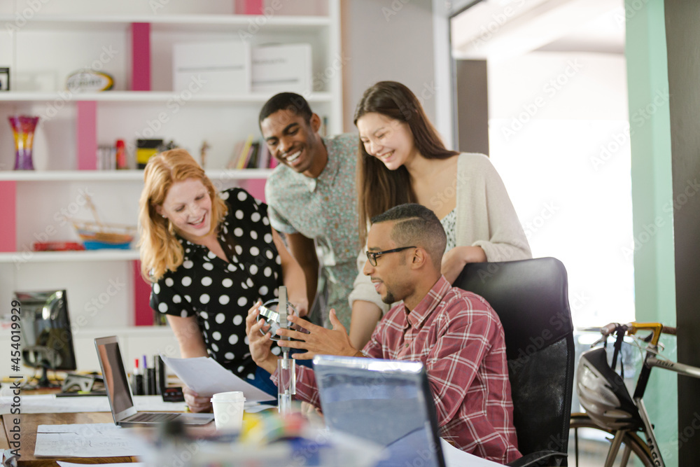 People examining model in office People examining model in office