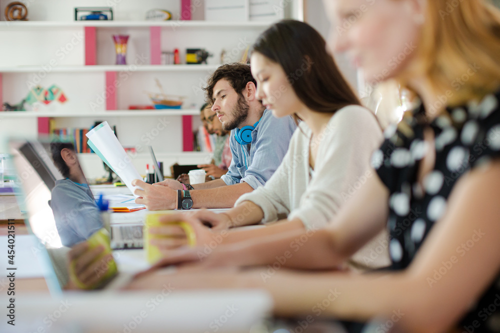 People working at conference table in office People working at conference table in office