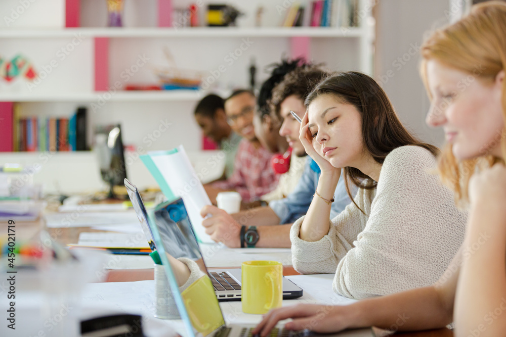 People working at conference table in office People working at conference table in office