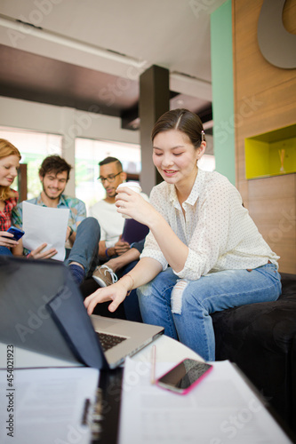Woman drinking coffee in office