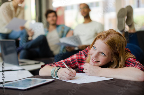 Woman writing in office