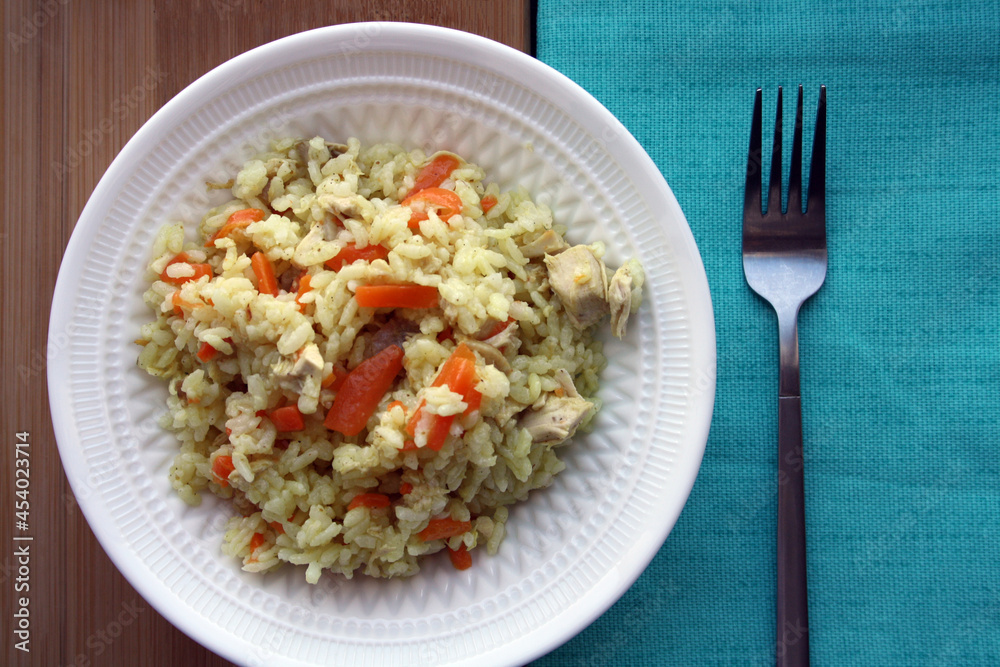 Flavorful pilaf of rice, carrots and chicken. Flavorful pilaf of rice, carrots and chicken.
