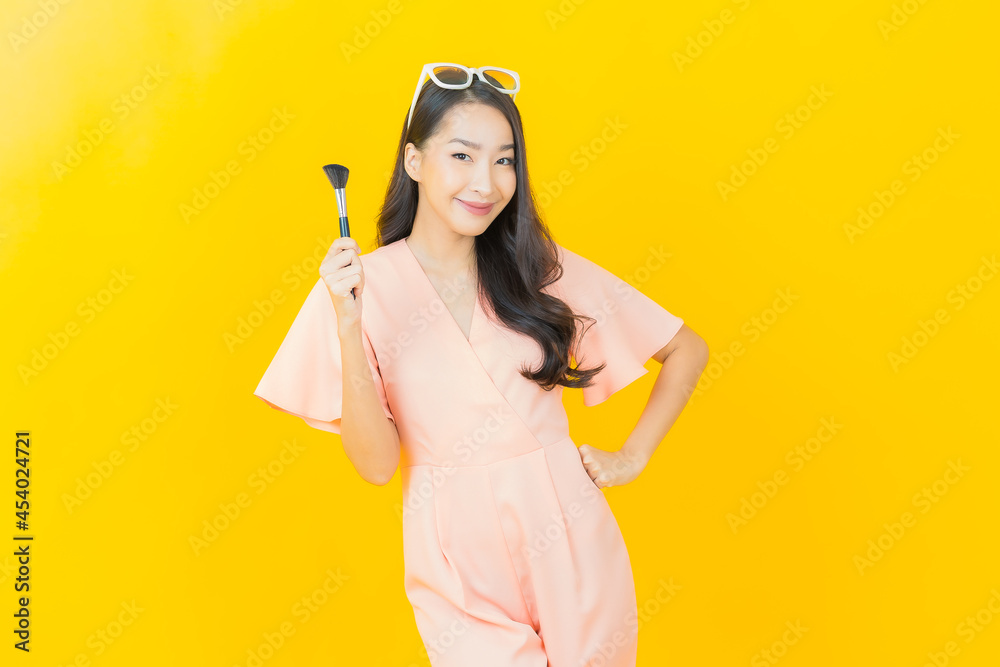 Portrait beautiful young asian woman with make up brush cosmetic Portrait beautiful young asian woman with make up brush cosmetic