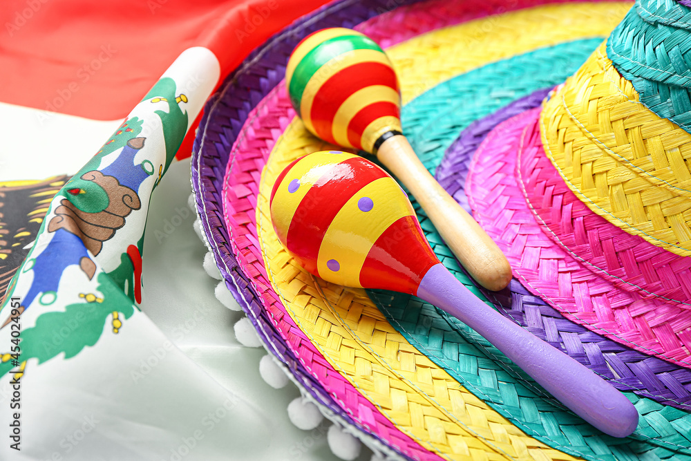 Maracas and sombrero on Mexican flag, closeup Stock Photo Adobe Stock