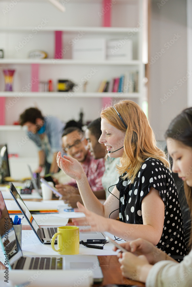 People working at conference table in office