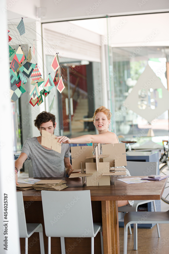 People building model together People building model together