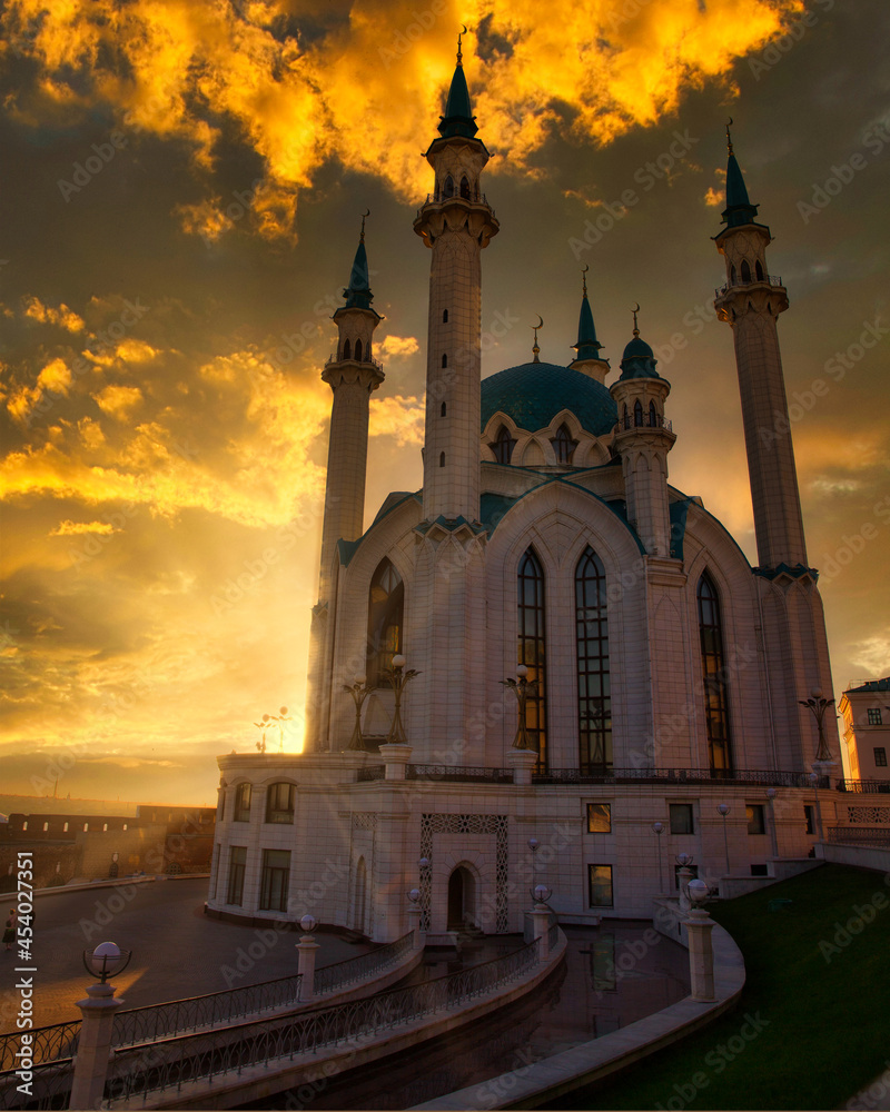 The Kul-Sharif mosque in the Kazan Kremlin against the backdrop of a beautiful sunset sky with sunbeams
