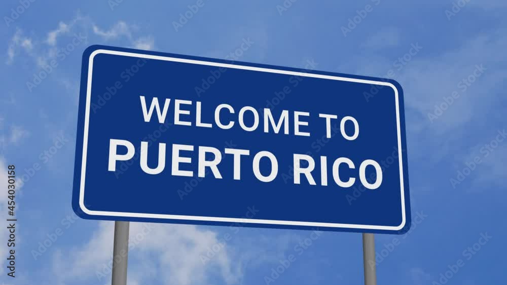 Welcome to Puerto Rico Road Sign on Clear Blue Sky with Rapid Moving Clouds Welcome to Puerto Rico Road Sign on Clear Blue Sky with Rapid Moving Clouds