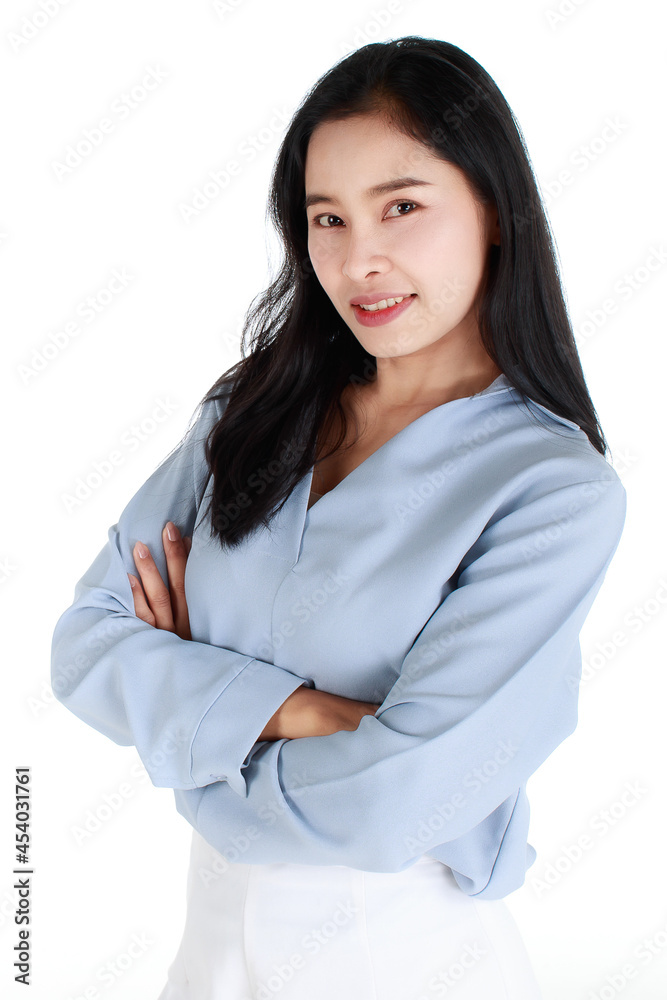 Close-up portrait of a smiling delightful elegant female in a casual light grey apparel with her arms crossed on chest looking at camera on white background. Close-up portrait of a smiling delightful elegant female in a casual light grey apparel with her arms crossed on chest looking at camera on white background.
