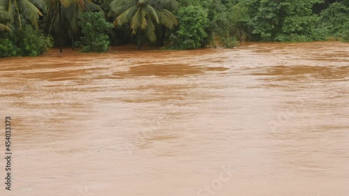 Shot of river water flowing over danger level photo