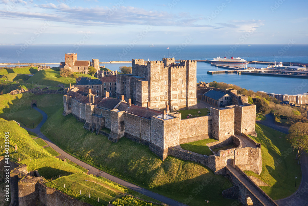 Dover, England, United Kingdom - May 10, 2021: View of Dover castle and harbour at sunset.