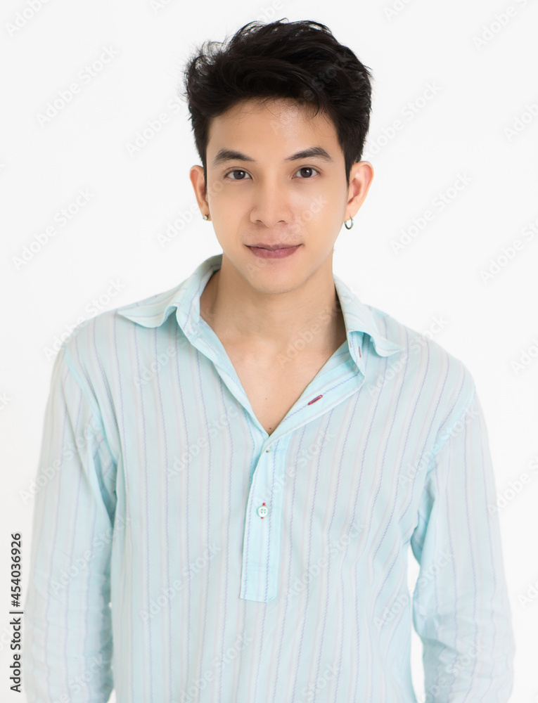 Young and handsome teenage black hair Asian man wearing earrings on white background Young and handsome teenage black hair Asian man wearing earrings on white background