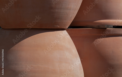 Closeup of pottery plant pots under sunlight photo