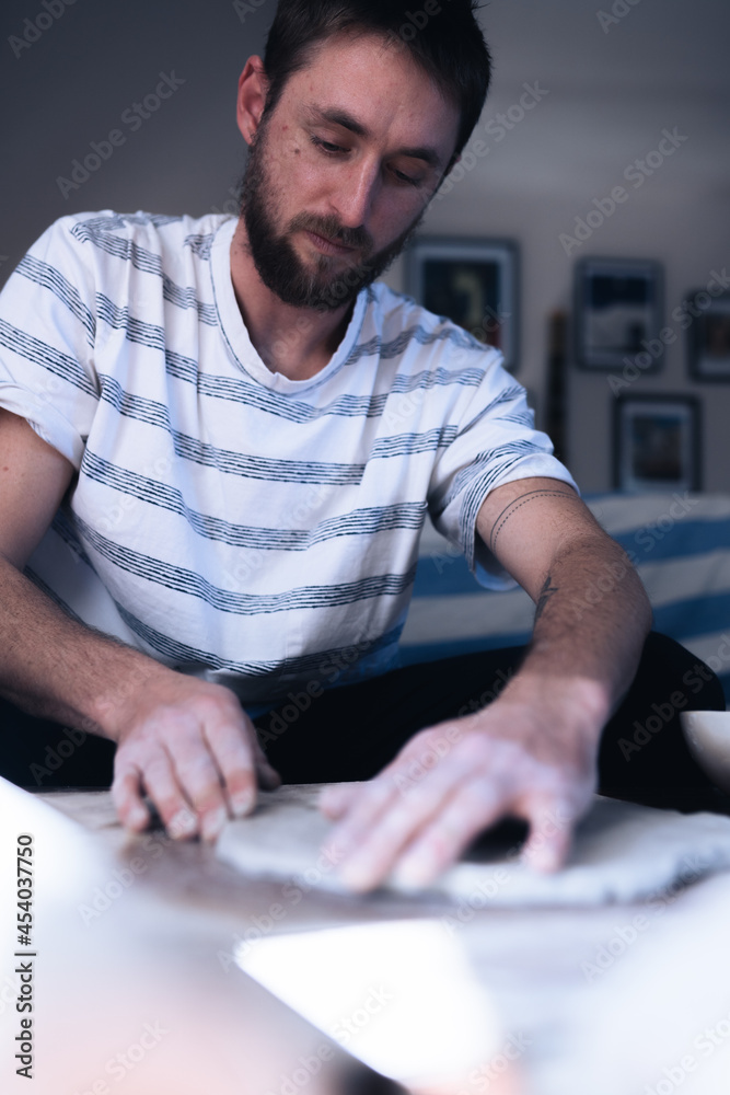 Man making ceramic plate Man making ceramic plate