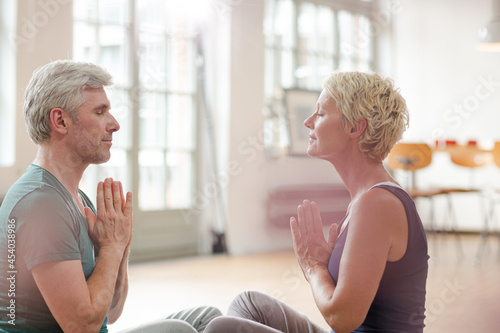 Older couple meditating
