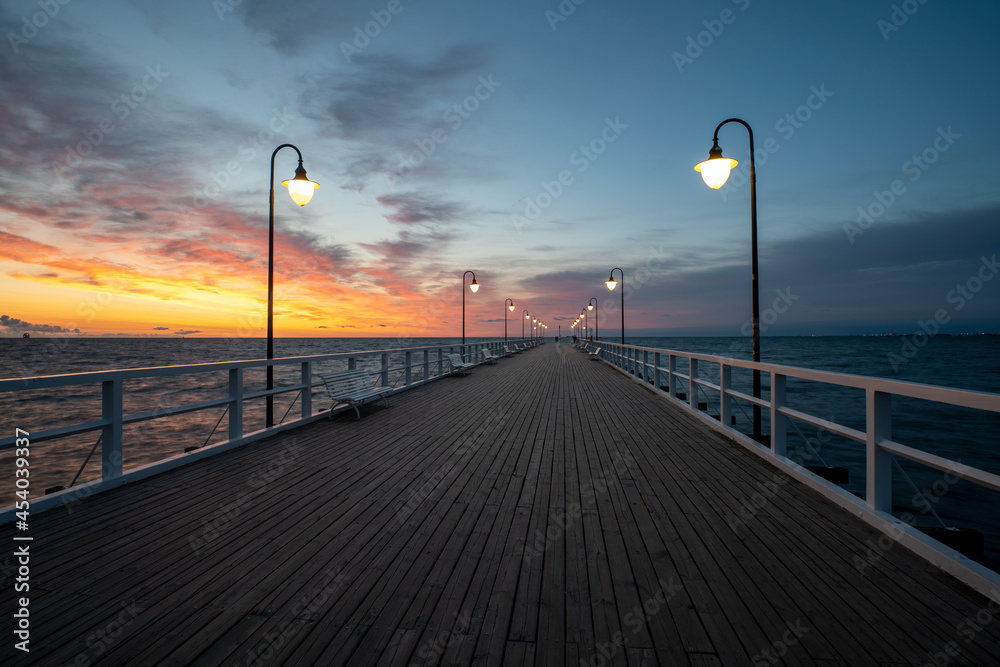 Naklejka premium Wooden Pier in Gdynia Orlowo during the spectacular sunrise