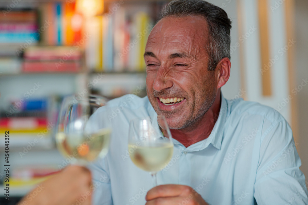 Older friends drinking white wine Older friends drinking white wine